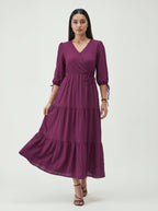 Woman wearing a purple dress on a white background