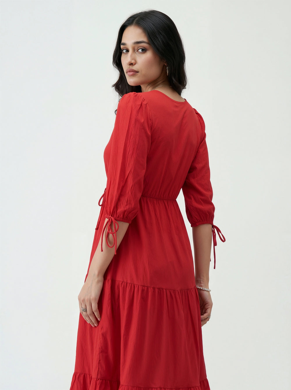 Woman wearing a red dress on a white background