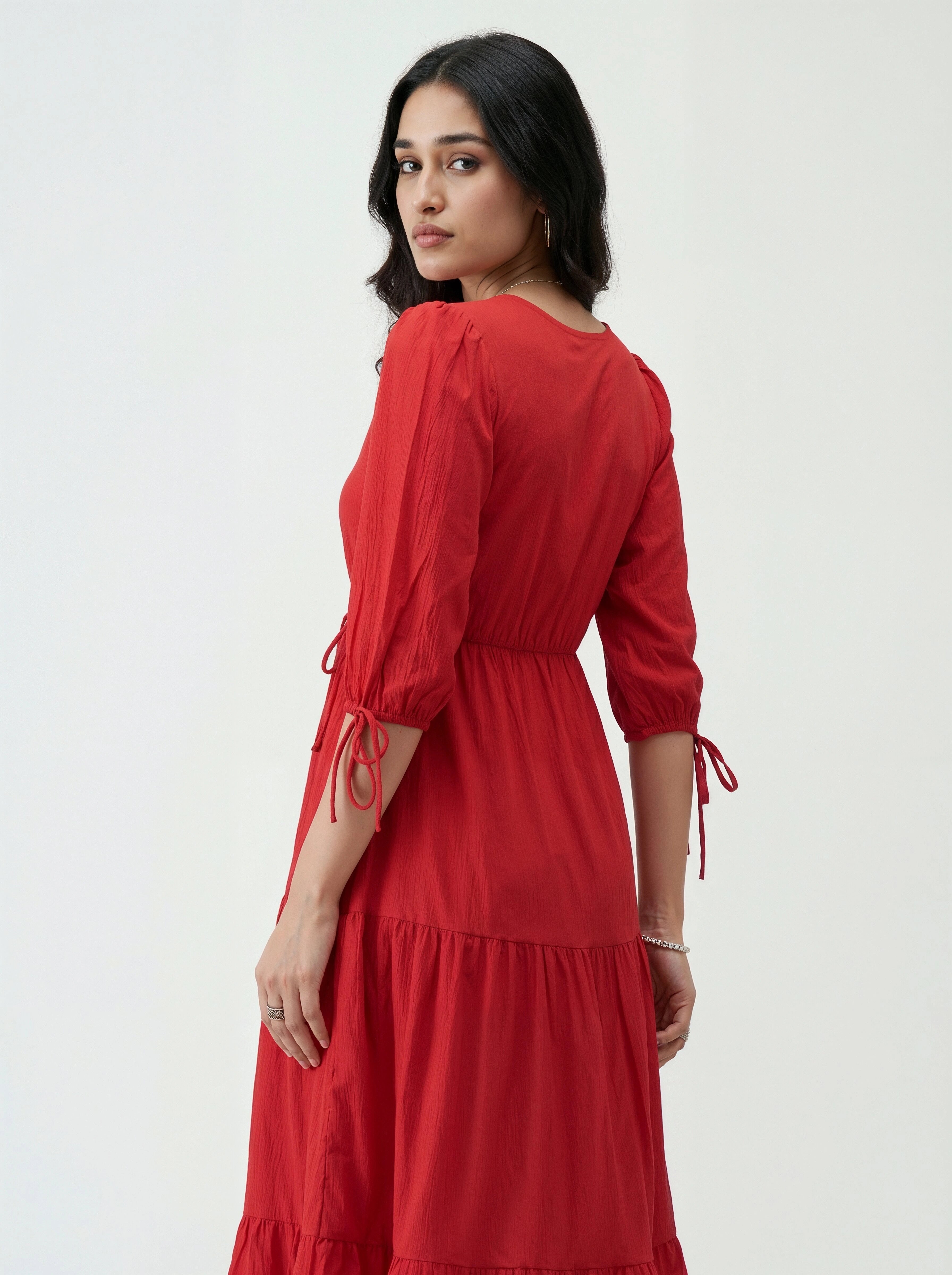 Woman wearing a red dress on a white background