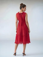 Woman wearing a red dress on a white background