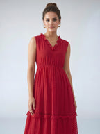 Woman wearing a red dress against a white background