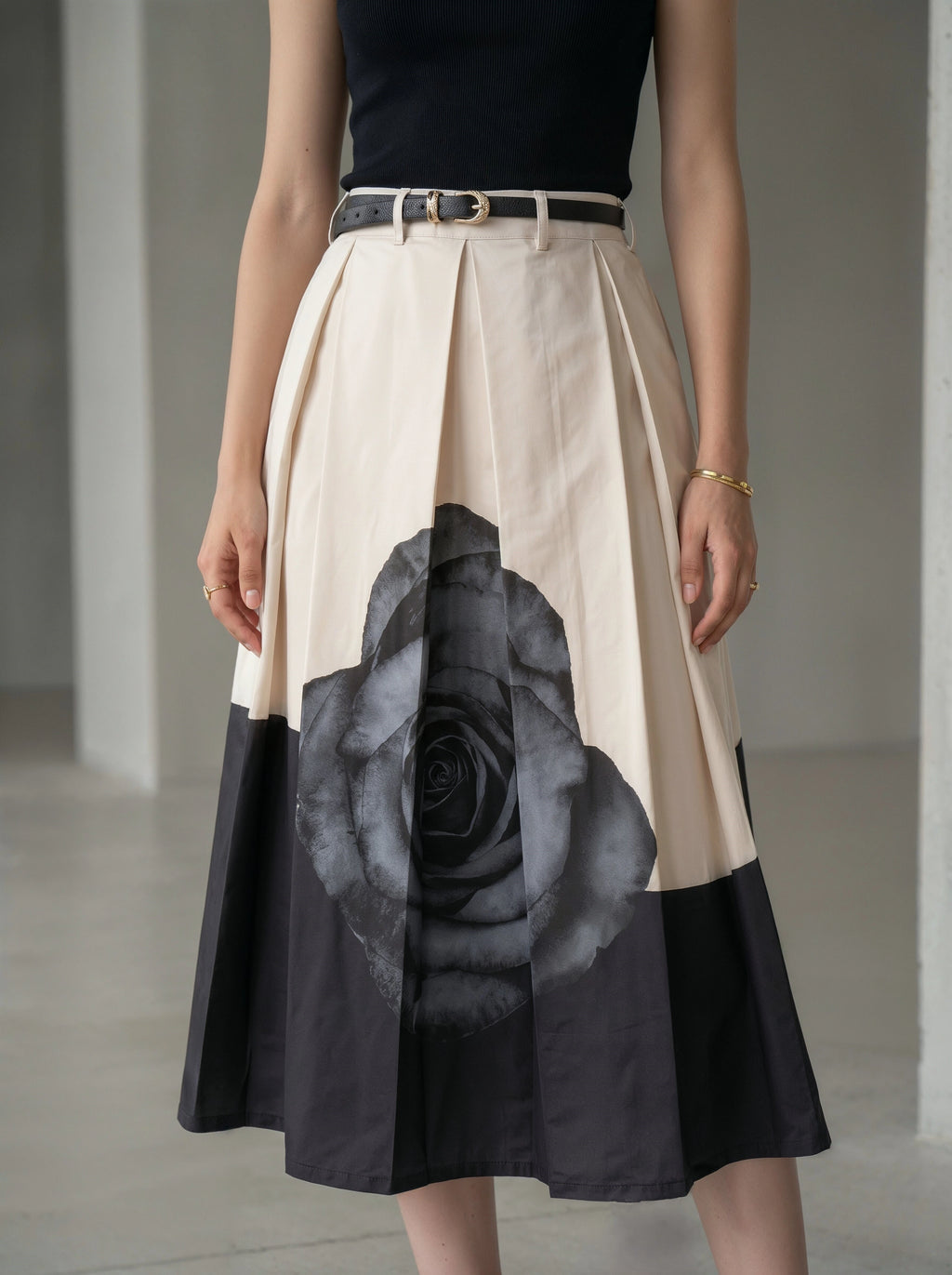 Skirt with black rose design on a neutral background