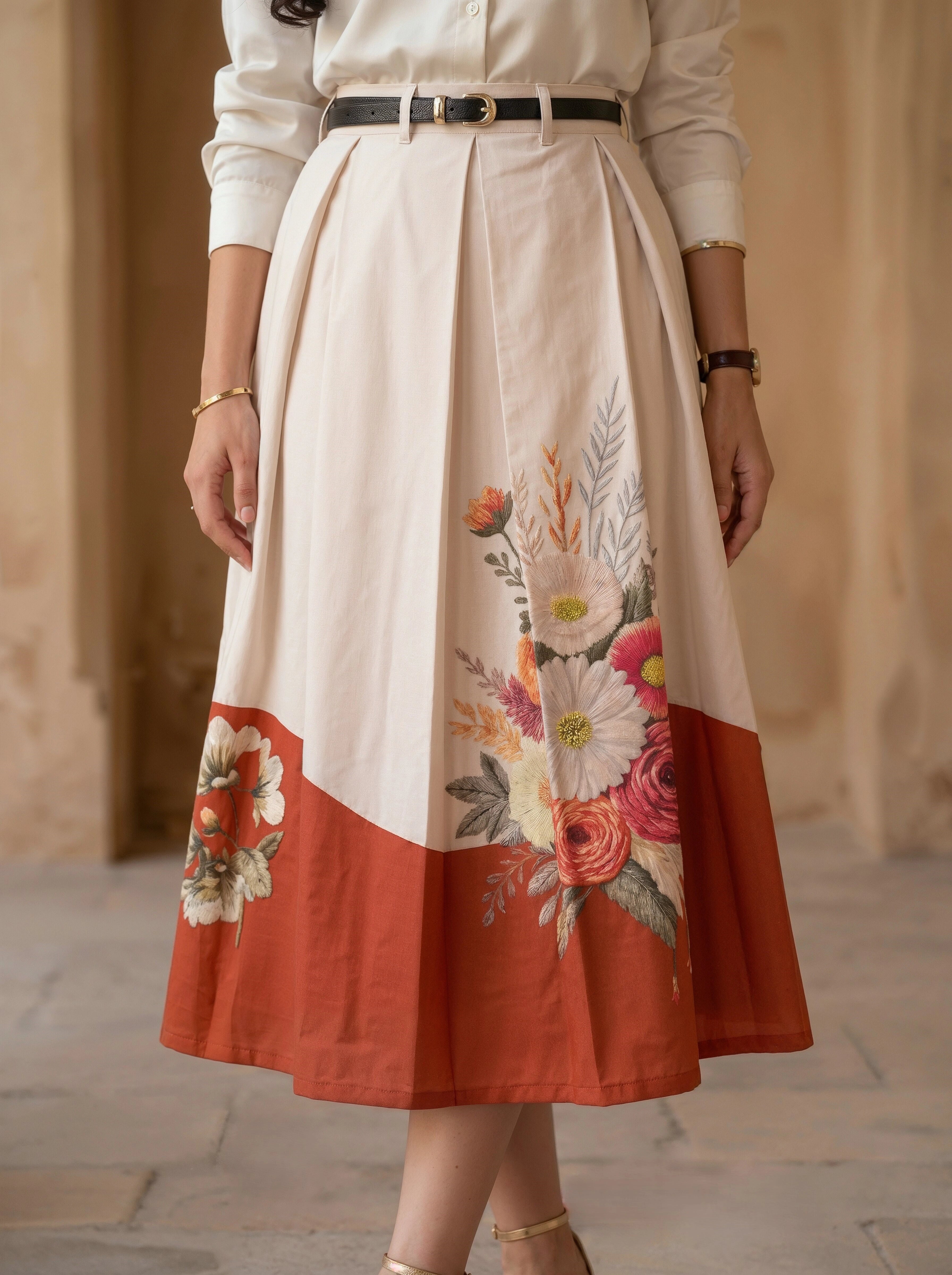 Skirt with floral design and color block pattern worn by a person.