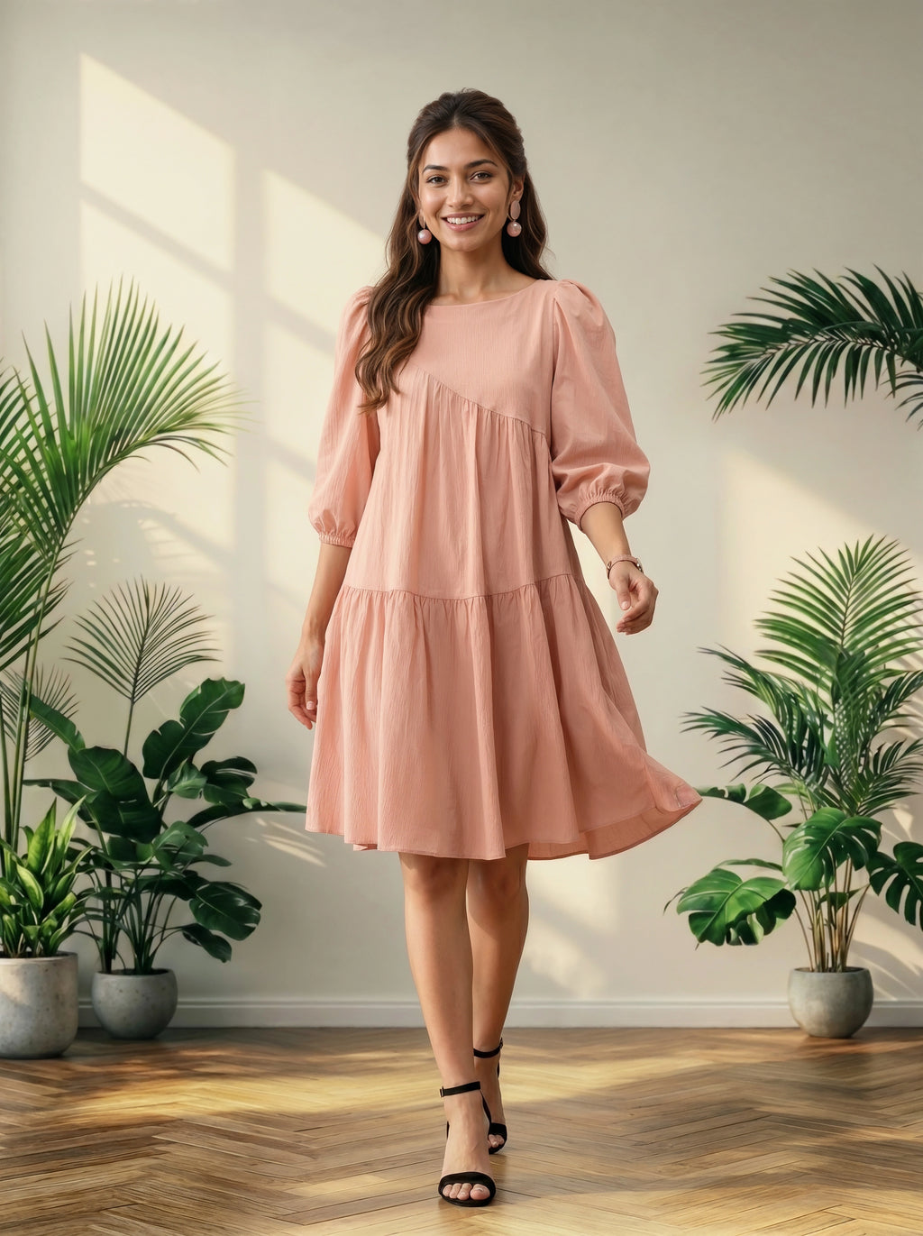 Woman in a pink dress standing in a room with plants