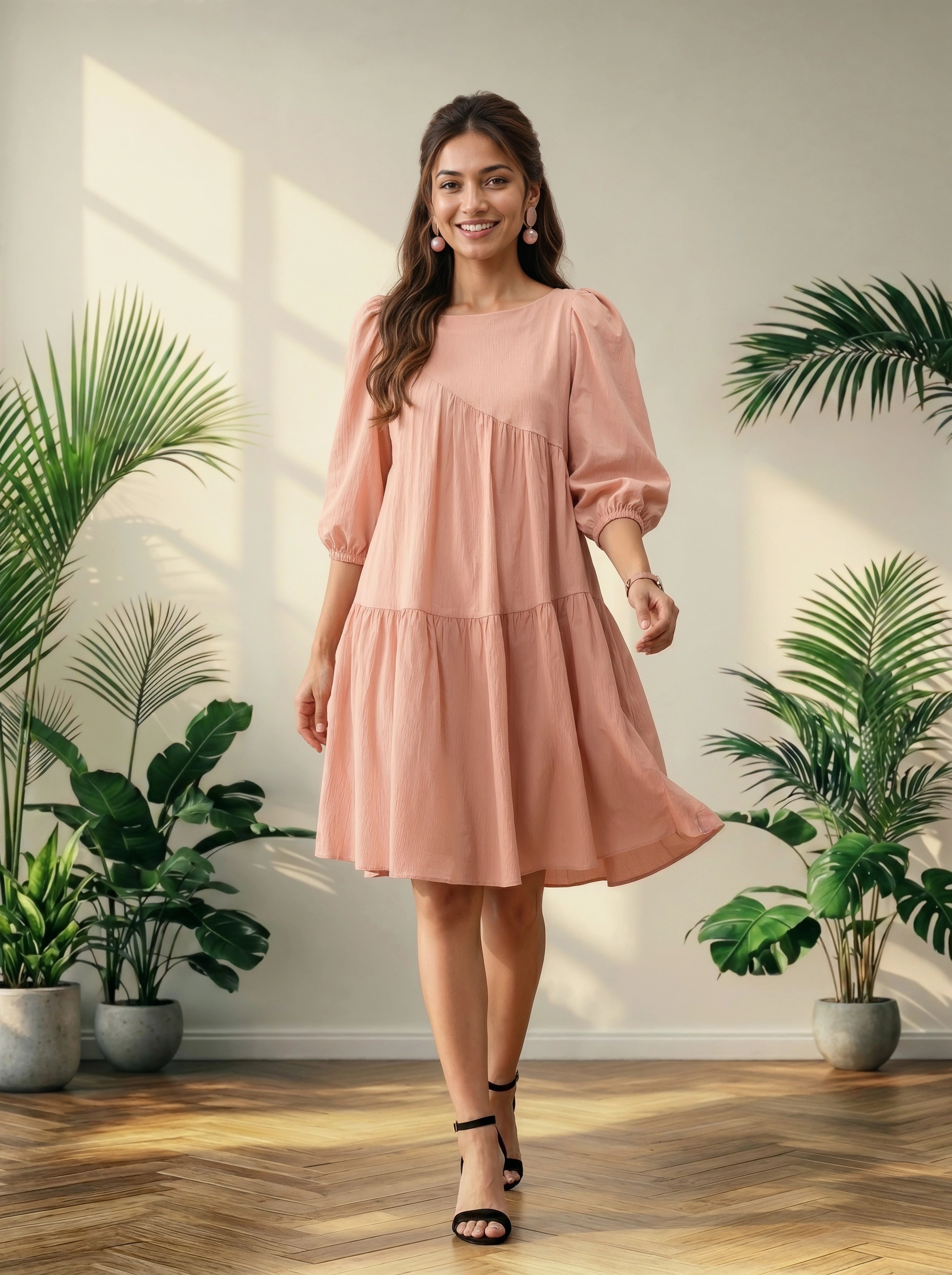 Woman in a pink dress standing in a room with plants