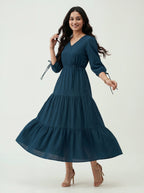 Woman wearing a blue dress on a white background