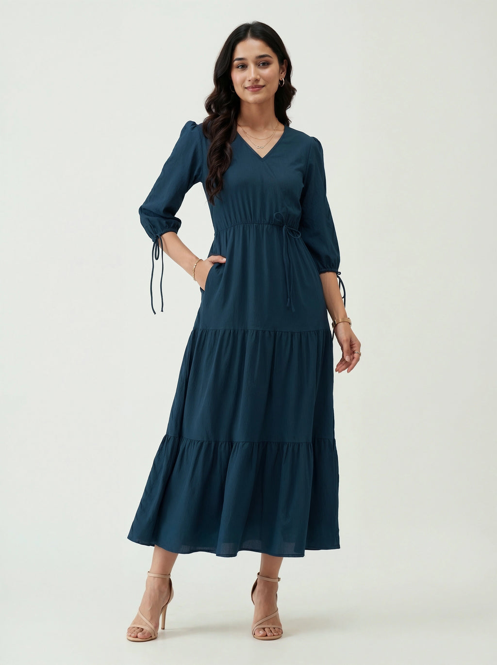 Woman wearing a blue dress on a white background