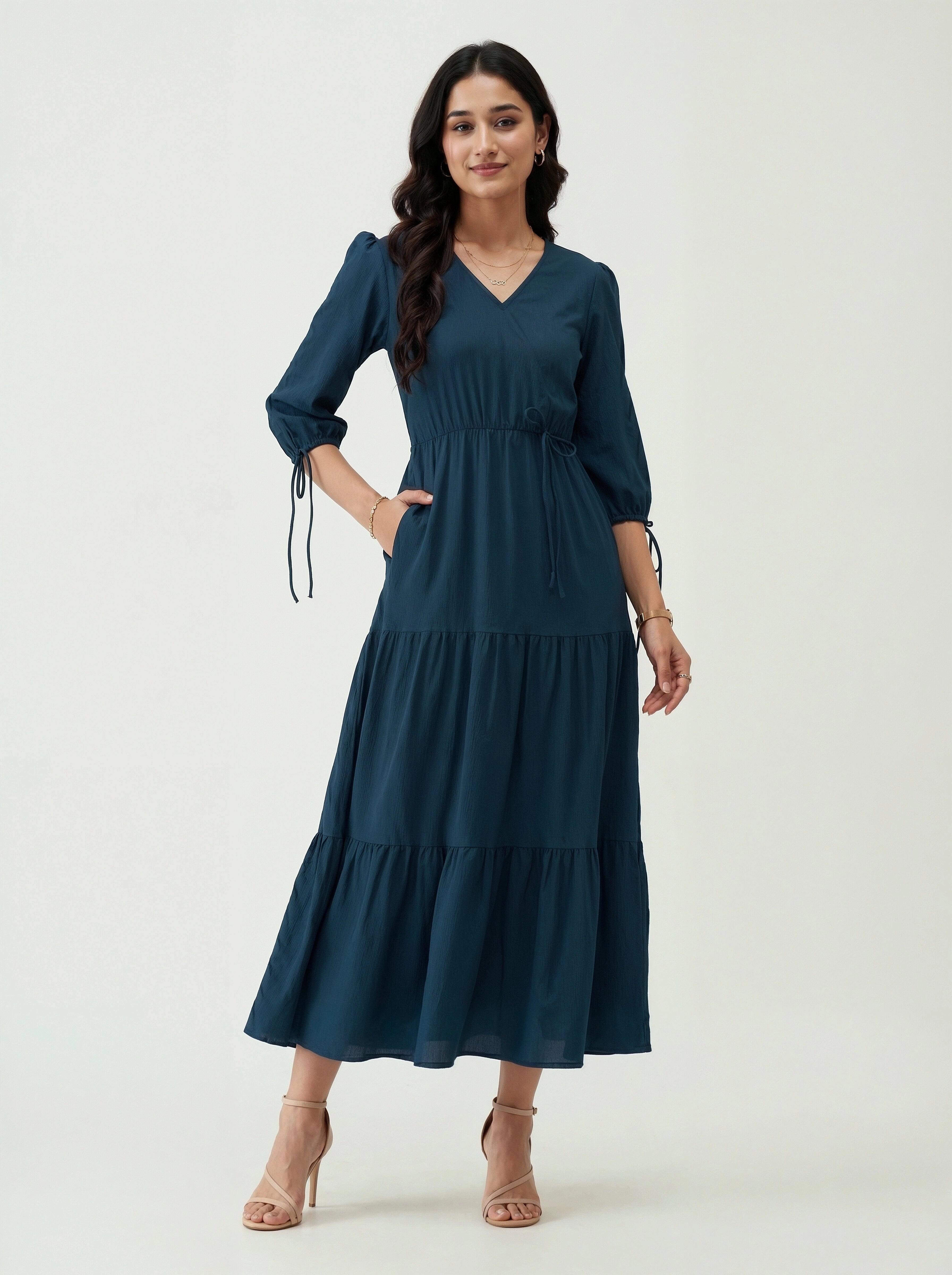 Woman wearing a blue dress on a white background