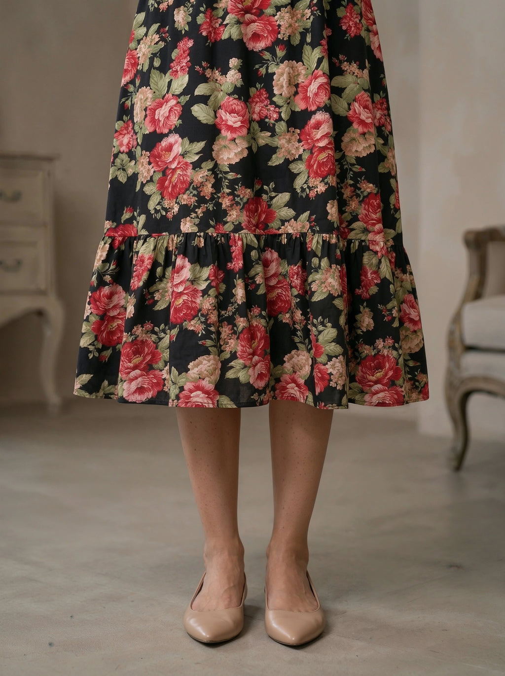 Floral patterned skirt worn by a person in an indoor setting