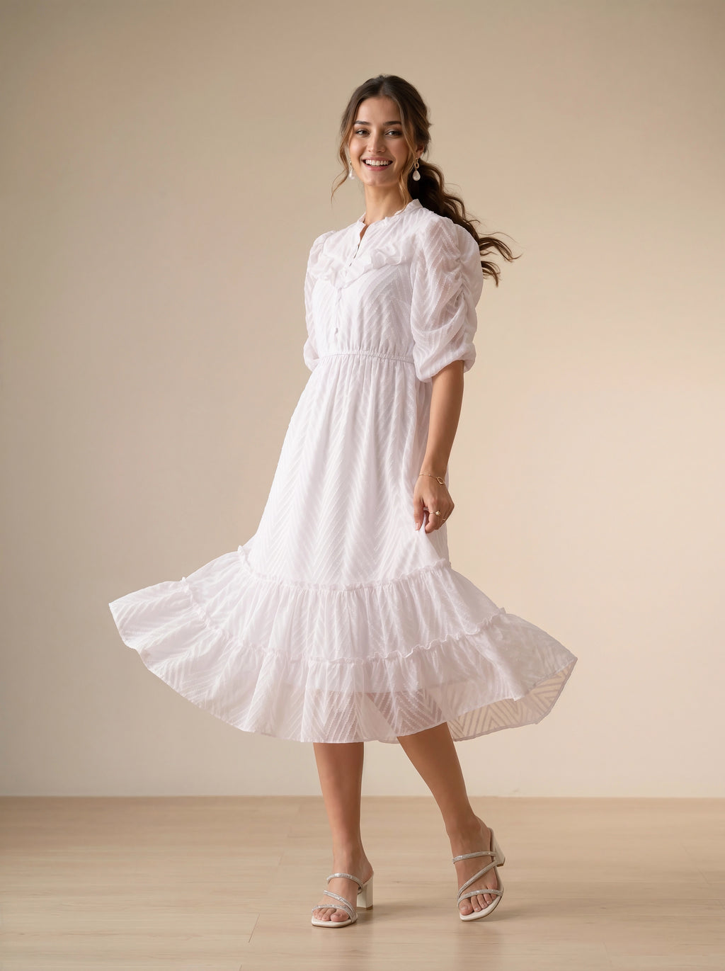 Woman wearing a white dress in a minimalistic setting