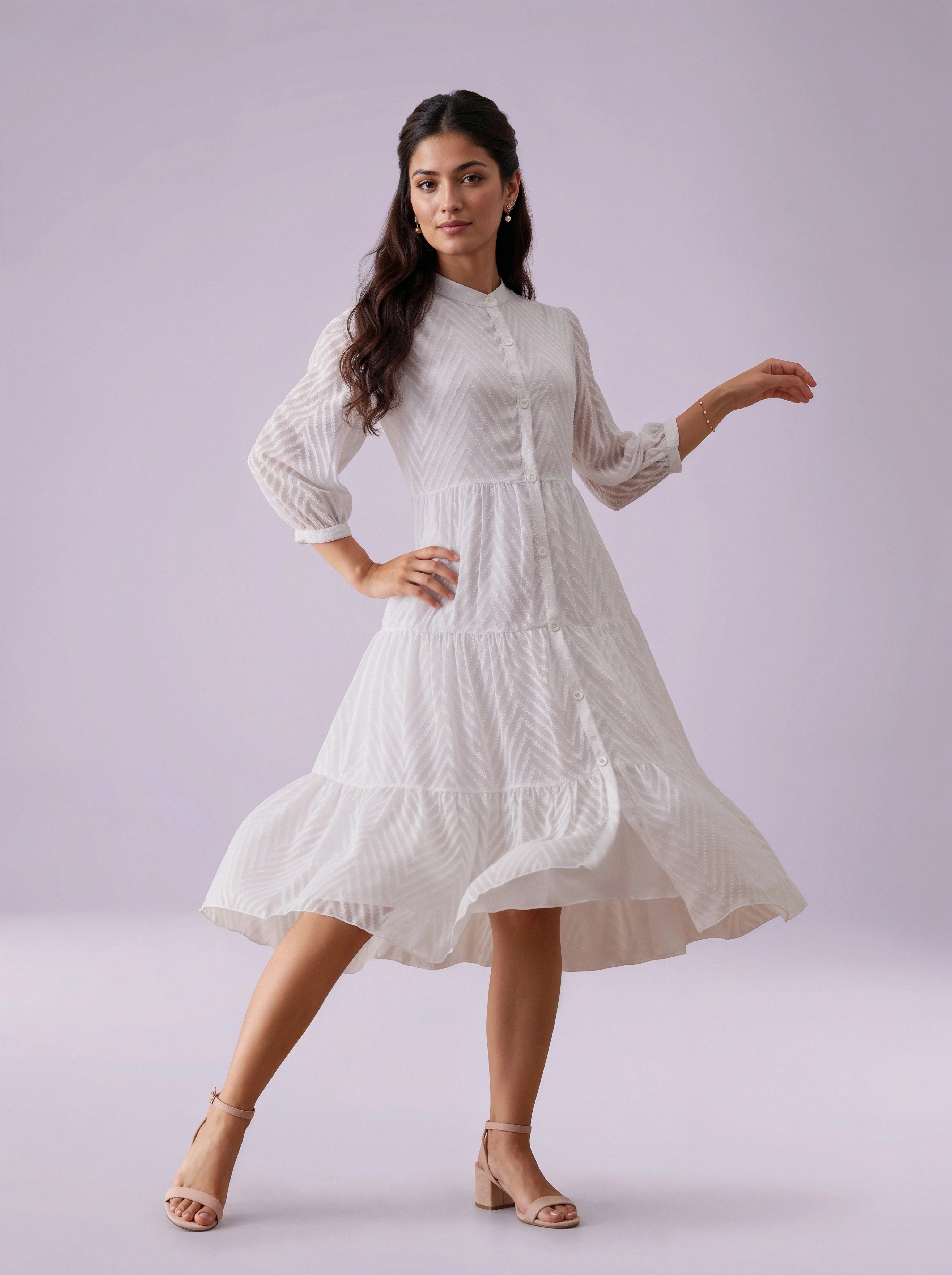 Woman wearing a white dress against a light purple background
