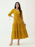 Woman wearing a yellow dress on a white background